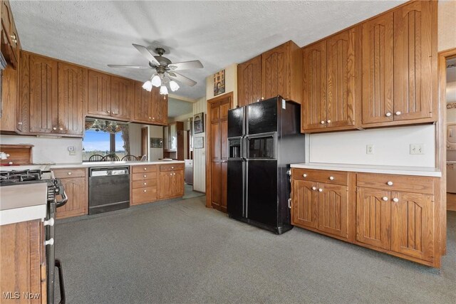 5706 Kemary Ave SW, Navarre, OH 44662 - kitchen with light carpet, light countertops, brown cabinets, ceiling fan, and black appliances