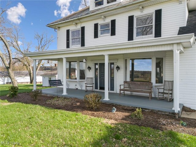 5706 Kemary Ave SW, Navarre, OH 44662 - view of front facade with a porch