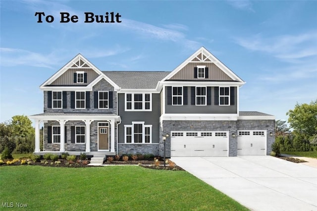 view of front of property with concrete driveway, stone siding, a front lawn, and board and batten siding