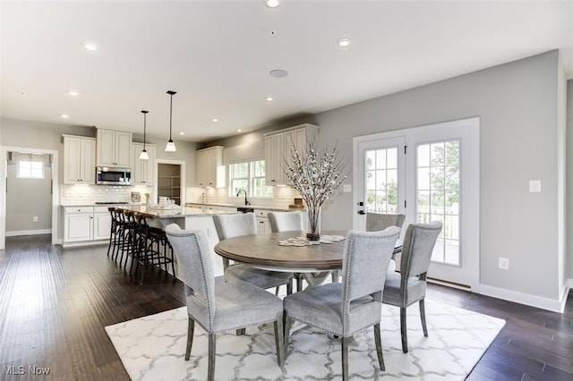 dining space featuring baseboards, recessed lighting, and dark wood-style floors