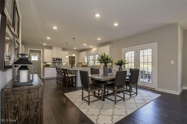dining room with recessed lighting, dark wood-style flooring, baseboards, and a healthy amount of sunlight
