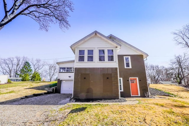 541 Canova Dr, Akron, OH 44319 - view of front of home with a garage and gravel driveway