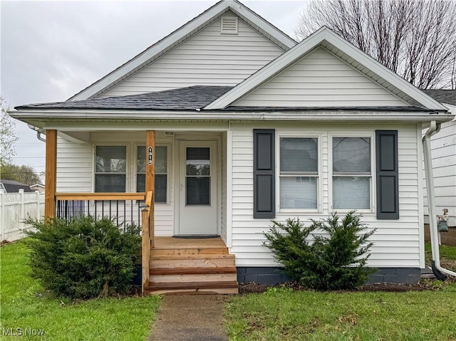 1313 12th St, Vienna, WV 26105 - bungalow-style house featuring roof with shingles, fence, and covered porch