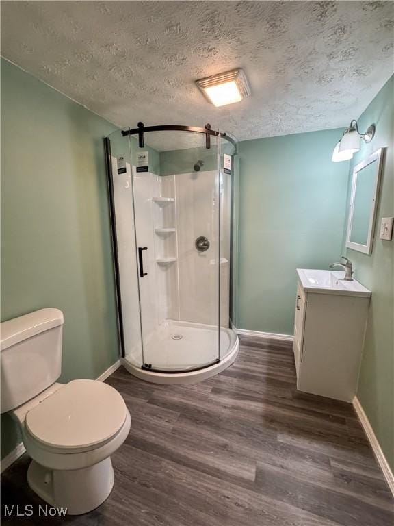 1313 12th St, Vienna, WV 26105 - full bathroom featuring vanity, baseboards, toilet, and wood finished floors
