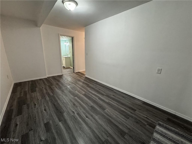 1313 12th St, Vienna, WV 26105 - empty room featuring dark wood-style flooring, visible vents, and baseboards