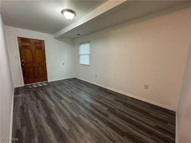 1313 12th St, Vienna, WV 26105 - spare room with baseboards and dark wood-style floors