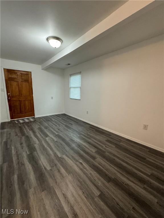 1313 12th St, Vienna, WV 26105 - below grade area featuring baseboards and dark wood finished floors