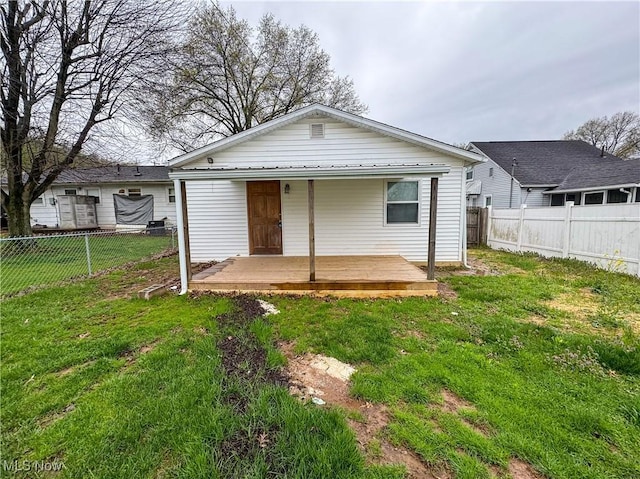 1313 12th St, Vienna, WV 26105 - rear view of house with a yard and a fenced backyard