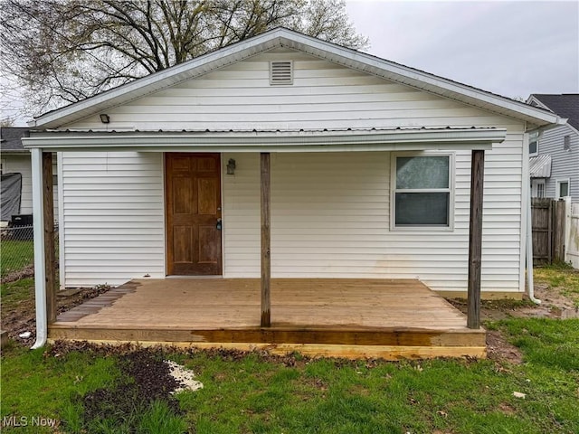 1313 12th St, Vienna, WV 26105 - back of property with fence and a deck