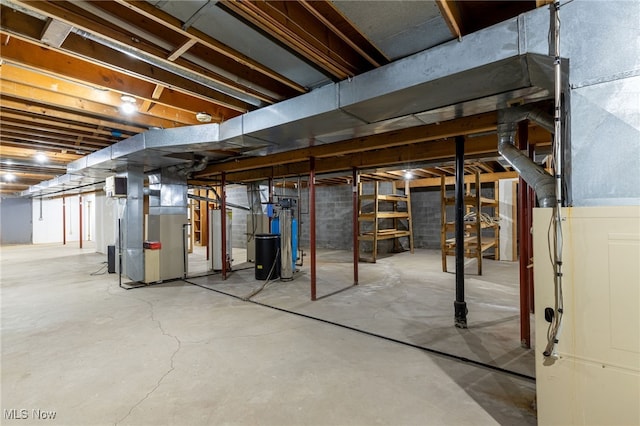 unfinished below grade area with water heater and heating unit
