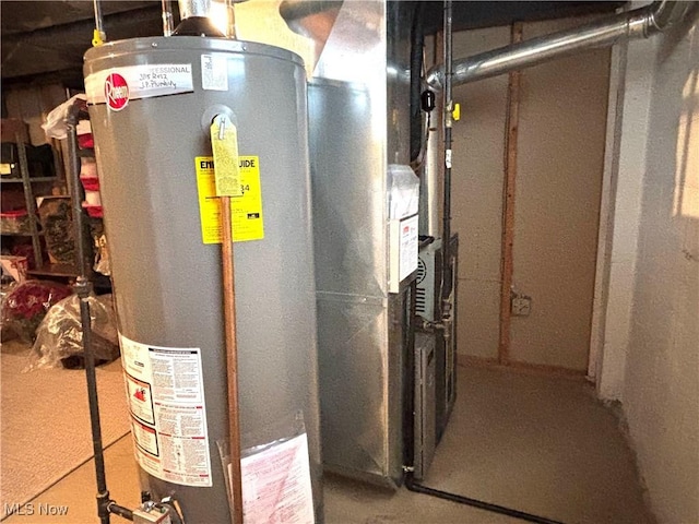 utility room featuring gas water heater and heating unit