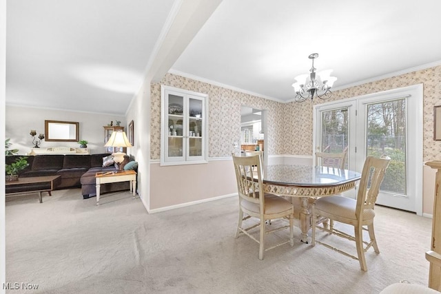 841 W Milton St, Alliance, OH 44601 - dining space featuring an inviting chandelier, a wealth of natural light, ornamental molding, and wallpapered walls