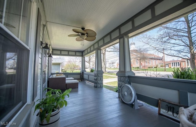 144 S Walnut St, Gnadenhutten, OH 44629 - sunroom with hardwood / wood-style floors, ceiling fan, and a residential view