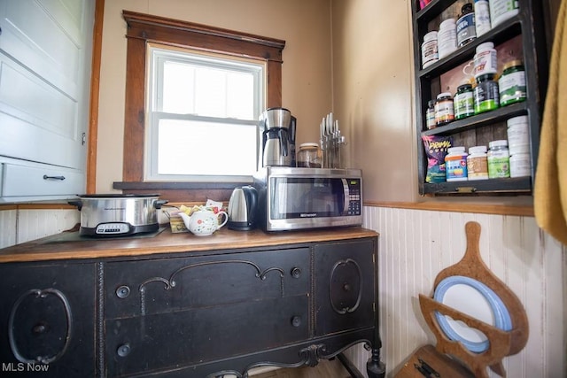 144 S Walnut St, Gnadenhutten, OH 44629 - details featuring wainscoting and stainless steel microwave