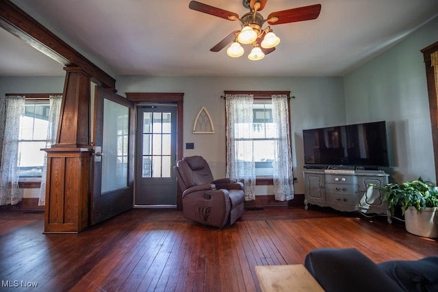 144 S Walnut St, Gnadenhutten, OH 44629 - living area with ceiling fan, a wealth of natural light, and dark wood-style floors