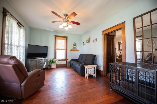 144 S Walnut St, Gnadenhutten, OH 44629 - living room with baseboards, ceiling fan, and hardwood / wood-style flooring