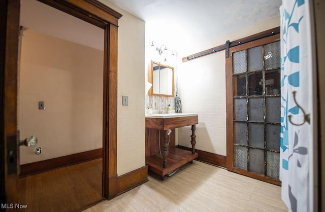 144 S Walnut St, Gnadenhutten, OH 44629 - bathroom with baseboards and wood finished floors
