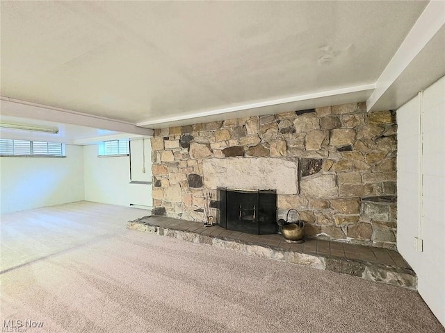 unfurnished living room featuring a fireplace and carpet floors