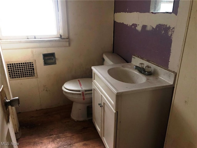 3331-33 W St, Weirton, WV 26062 - half bathroom with vanity, hardwood / wood-style floors, and toilet
