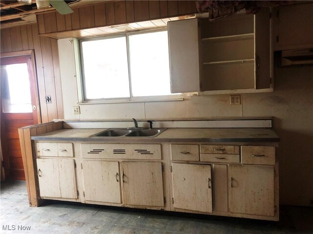 3331-33 W St, Weirton, WV 26062 - kitchen featuring wooden walls and a sink