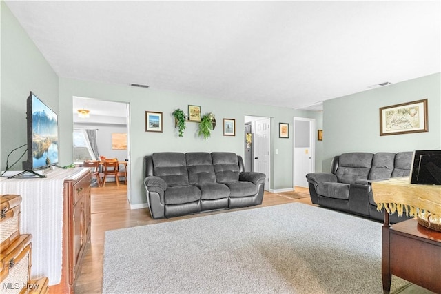 4000 S Mahoning Ave, Alliance, OH 44601 - living area with visible vents, baseboards, and wood finished floors