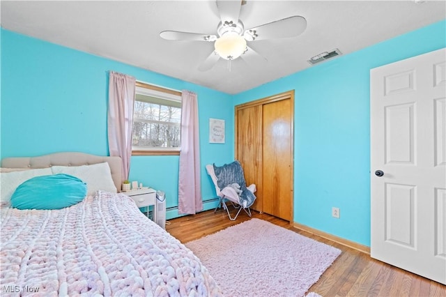 4000 S Mahoning Ave, Alliance, OH 44601 - bedroom featuring wood finished floors, ceiling fan, a closet, and visible vents