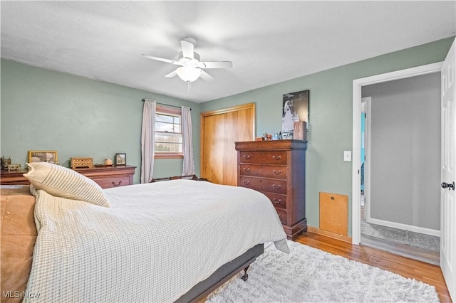 4000 S Mahoning Ave, Alliance, OH 44601 - bedroom featuring baseboards, a closet, a ceiling fan, and wood finished floors