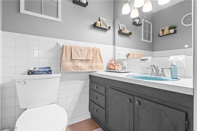 4000 S Mahoning Ave, Alliance, OH 44601 - bathroom with toilet, tile walls, vanity, and wood finished floors