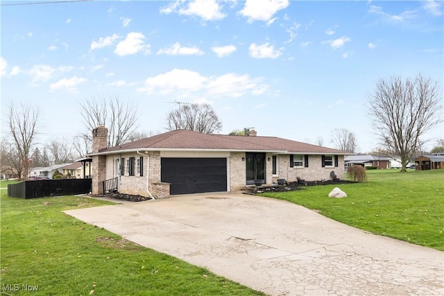 4000 S Mahoning Ave, Alliance, OH 44601 - single story home with an attached garage, a chimney, brick siding, a front lawn, and driveway