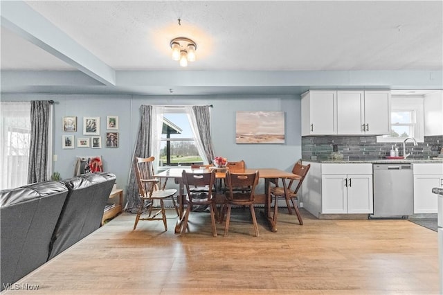 4000 S Mahoning Ave, Alliance, OH 44601 - dining area featuring light wood-style floors and beamed ceiling