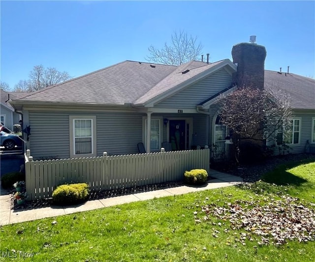 47 Woodland Chase Blvd, Niles, OH 44446 - view of front of property with roof with shingles, a chimney, and a fenced front yard