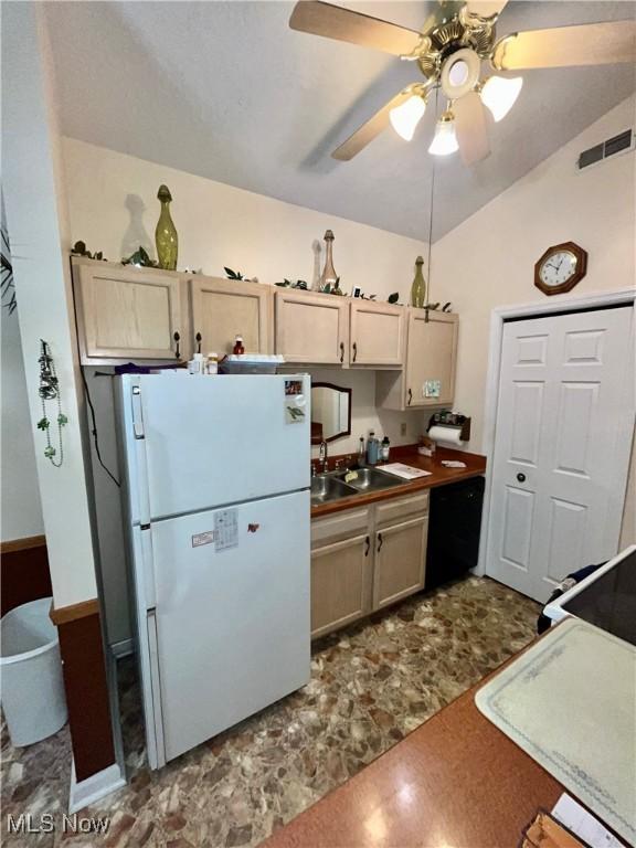 47 Woodland Chase Blvd, Niles, OH 44446 - kitchen featuring lofted ceiling, freestanding refrigerator, black dishwasher, ceiling fan, and a sink