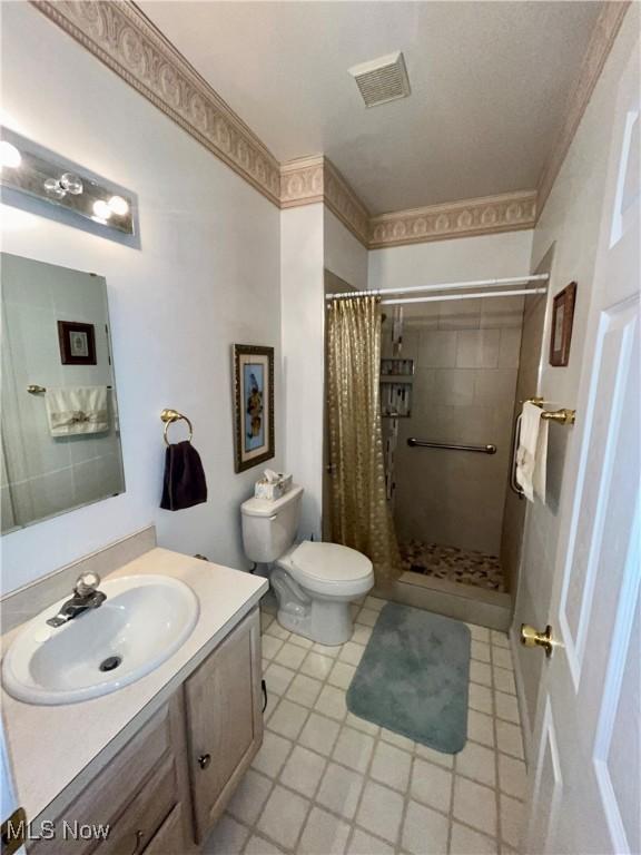 47 Woodland Chase Blvd, Niles, OH 44446 - bathroom with visible vents, toilet, a shower stall, vanity, and tile patterned flooring