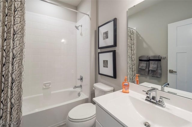 full bath with toilet, shower / tub combo with curtain, and vanity