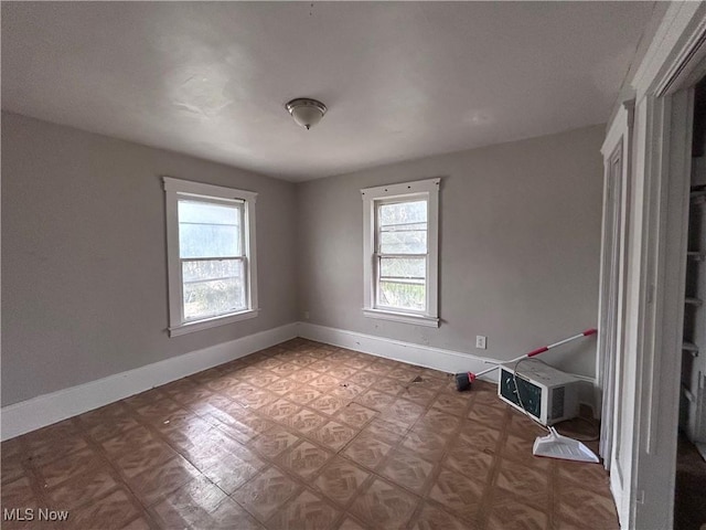 945 E 149th St, Cleveland, OH 44110 - unfurnished room with baseboards and a wealth of natural light