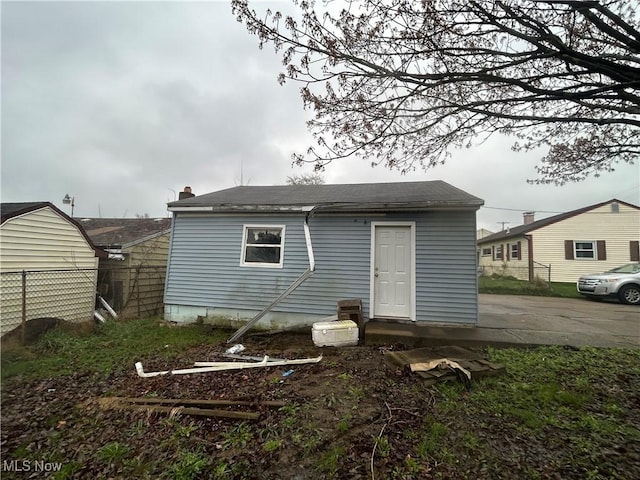 2424 Mccartney Rd, Youngstown, OH 44505 - rear view of property with a shingled roof and fence