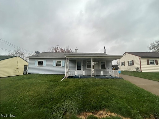 2424 Mccartney Rd, Youngstown, OH 44505 - back of property featuring a lawn and covered porch