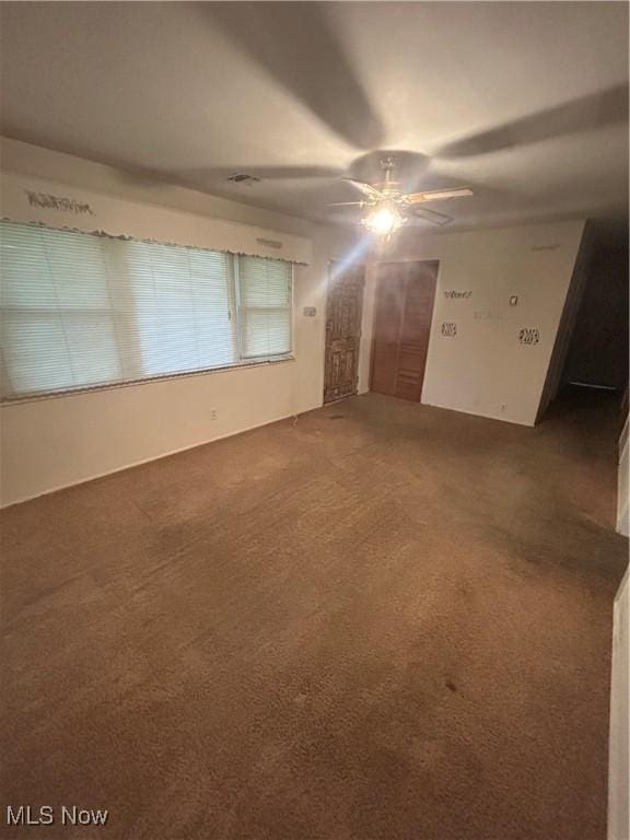 2424 Mccartney Rd, Youngstown, OH 44505 - empty room with a ceiling fan and carpet