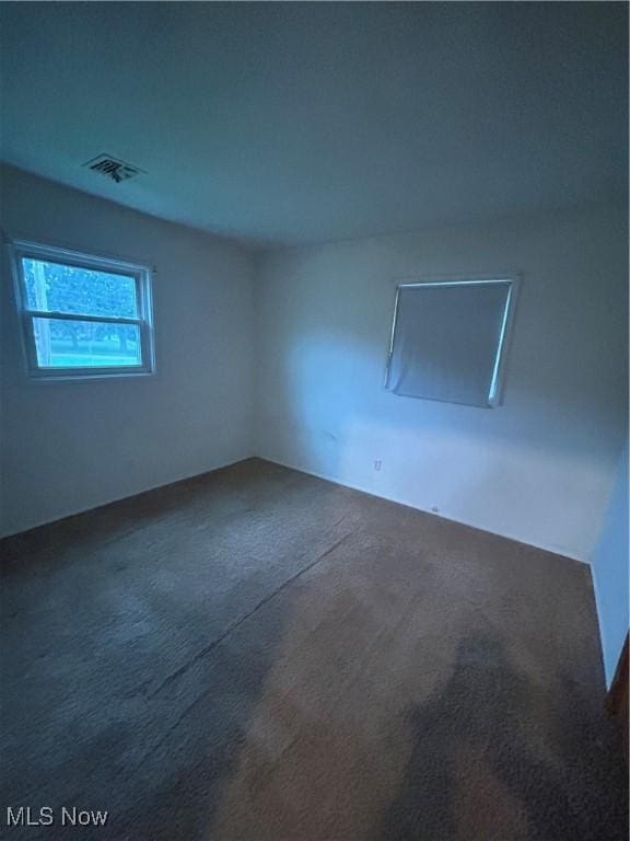 2424 Mccartney Rd, Youngstown, OH 44505 - spare room with dark carpet and visible vents