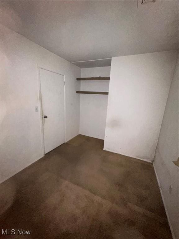 2424 Mccartney Rd, Youngstown, OH 44505 - unfurnished bedroom with dark carpet