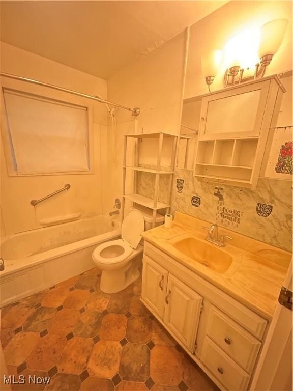 2424 Mccartney Rd, Youngstown, OH 44505 - full bathroom featuring vanity, bathtub / shower combination, toilet, and decorative backsplash