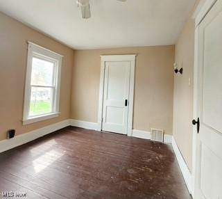 702 Dickson St, Youngstown, OH 44502 - unfurnished bedroom with a closet, hardwood / wood-style flooring, visible vents, and baseboards
