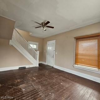 702 Dickson St, Youngstown, OH 44502 - entryway featuring baseboards, a ceiling fan, hardwood / wood-style flooring, and stairway