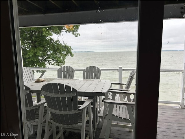 1252 Tri Motor Dr Unit 213, Put-In-Bay, OH 43456 - wooden deck with a water view and outdoor dining area