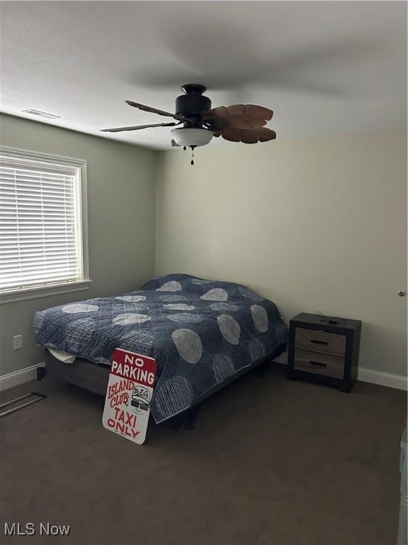 1252 Tri Motor Dr Unit 213, Put-In-Bay, OH 43456 - carpeted bedroom with a ceiling fan and baseboards