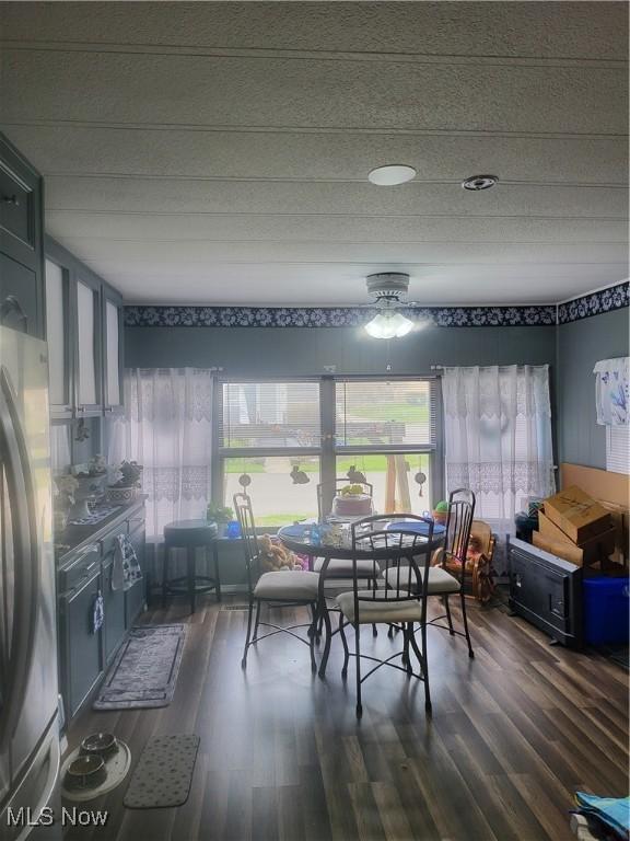 58 Wilpark Dr, Akron, OH 44312 - dining space featuring ceiling fan and dark wood finished floors