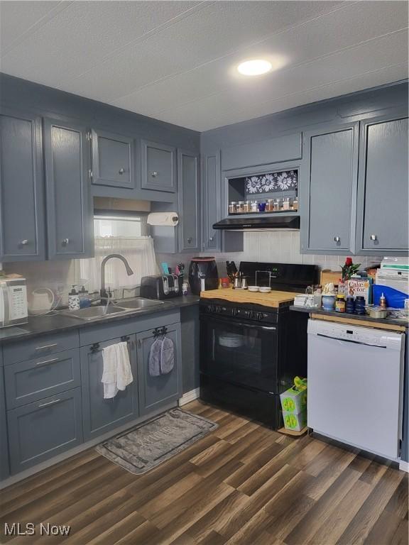 58 Wilpark Dr, Akron, OH 44312 - kitchen with open shelves, a sink, white appliances, under cabinet range hood, and dark wood finished floors
