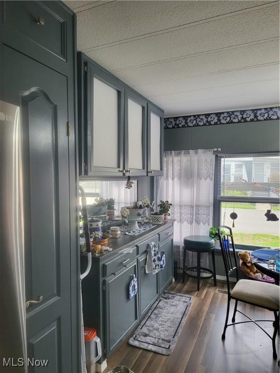 58 Wilpark Dr, Akron, OH 44312 - kitchen featuring dark wood-style flooring and a textured ceiling