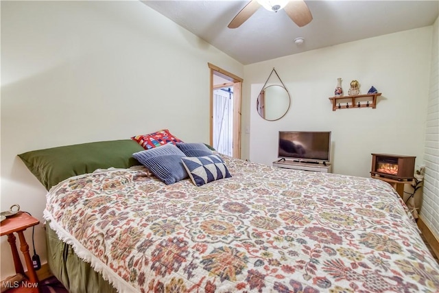 bedroom featuring wood finished floors and a ceiling fan