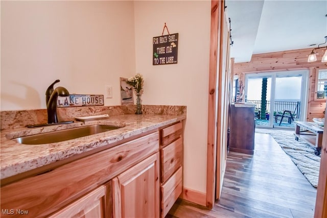 interior space featuring wood finished floors and vanity